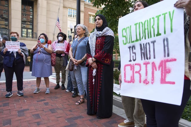 Mapheze Saleh, at center, wife of arrested and detained Georgetown University scholar Badar Khan Suri, attends a news conference following her husband's hearing at the Federal District Court for the Eastern District of Virginia, in Alexandria, Va., Thursday, May 1, 2025. (AP Photo/Jacquelyn Martin)