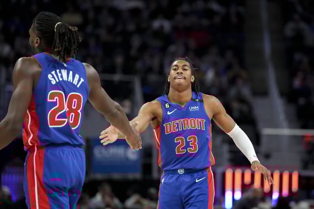 DETROIT, MICHIGAN - DECEMBER 28: Isaiah Stewart #28 and Jaden Ivey #23 of the Detroit Pistons high five against the Orlando Magic during the third quarter at Little Caesars Arena on December 28, 2022 in Detroit, Michigan.