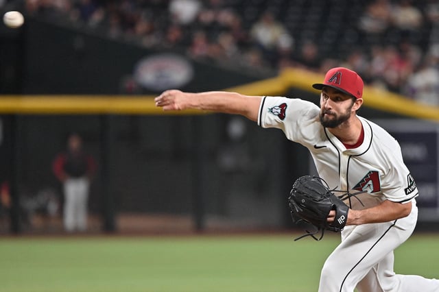 Apr 24, 2025; Phoenix, Arizona, USA;  Arizona Diamondbacks pitcher J.P. Feyereisen (61) throws in the tenth inning against the Tampa Bay Rays at Chase Field. Mandatory Credit: Matt Kartozian-Imagn Images/File Photo