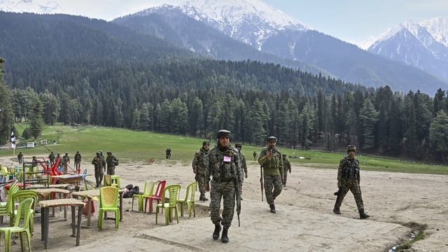 Security officers inspect the site a day after where suspected terrorists opened fire at tourists in Pahalgam. (AP)