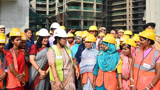 Delhi CM Rekha Gupta interacts with workers at a construction site on New Rohtak Road. (Vipin Kumar/HT Photo)