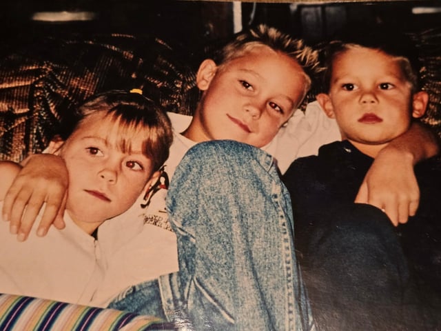 Amanda, Geoffrey and Logan Flaherty are seen in a provided photo.