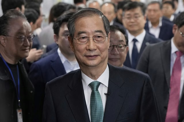 South Korean former Prime Minister Han Duck-soo arrives to hold a press conference to announce a presidential bid at the National Assembly in Seoul, South Korea, Friday, May 2, 2025. (AP Photo/Ahn Young-joon)