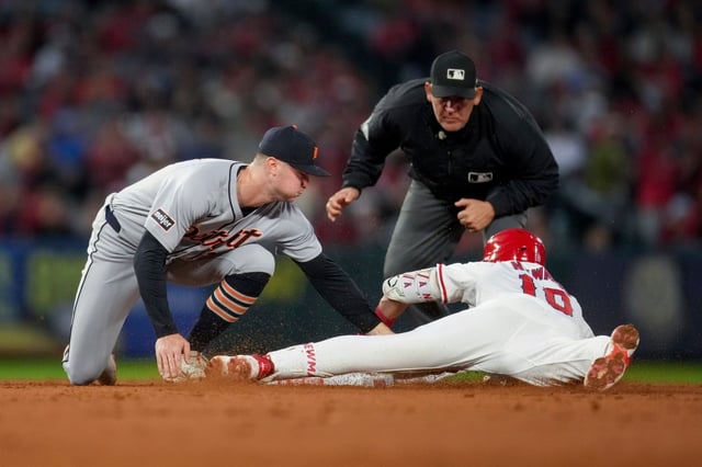 Detroit Tigers shortstop Trey Sweeney, left, tags out the Angels’ Kevin Newman at second base during the fourth inning on Thursday night at Angel Stadium. (AP Photo/Eric Thayer)