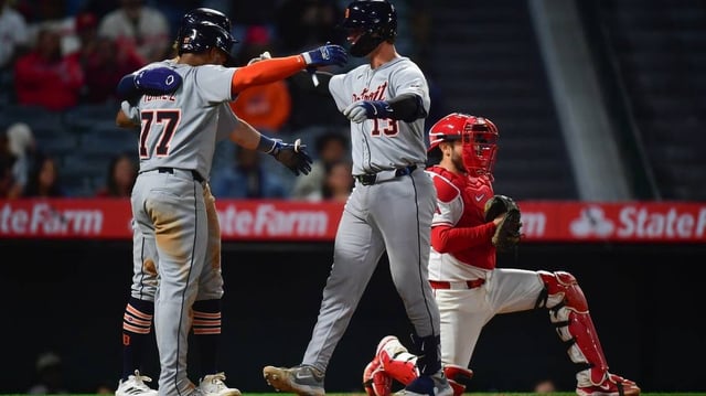 May 1, 2025; Anaheim, California, USA; Detroit Tigers catcher Dillon Dingler (13) is greeted by third baseman Andy Ibanez (77) and left fielder Zach McKinstry (39) after hitting a three run home run against the Los Angeles Angels during the eighth inning at Angel Stadium. Mandatory Credit: Gary A. Vasquez-Imagn Images