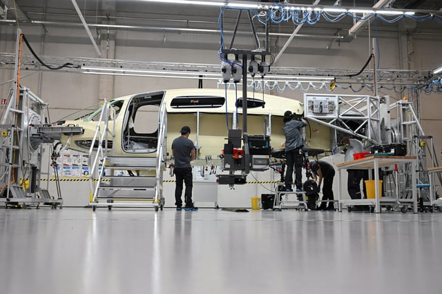 An electrically powered vertical take-off and landing aircraft (eVTOL), which can carry up to 6 passengers, from the German aviation company Lilium is being built in a factory hall in Gauting, Germany, October 14, 2024. REUTERS/Angelika Warmuth/File Photo