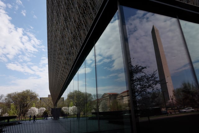People enter and exit the Smithsonian’s National Museum of African American History and Culture in Washington, D.C., U.S., March 28, 2025. REUTERS/Leah Millis/File Photo