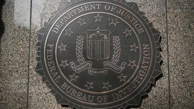 The seal of the Federal Bureau of Investigation (FBI) on the J. Edgar Hoover Federal Bureau of Investigation (FBI) building in Washington, DC, US, on Monday, March 10, 2025. (Photo by Brendan SMIALOWSKI / AFP)