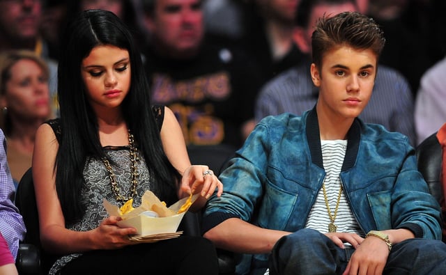 Justin Bieber and Selena Gomez in attendance to watch the Los Angeles Lakers play against the San Antonio Spurs during the first half at Staples Center, April 17, 2012, Los Angeles.