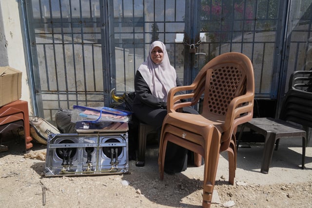 Residents of the now evacuated refugee camp of Tulkarem return to collect belongings before the destruction of their homes as Israeli forces prepare to carry out the demolition of 116 homes across the two refugee camps of the Israeli occupied West Bank city of Tulkarem, Friday, May 2, 2025. (AP Photo/Nasser Nasser)