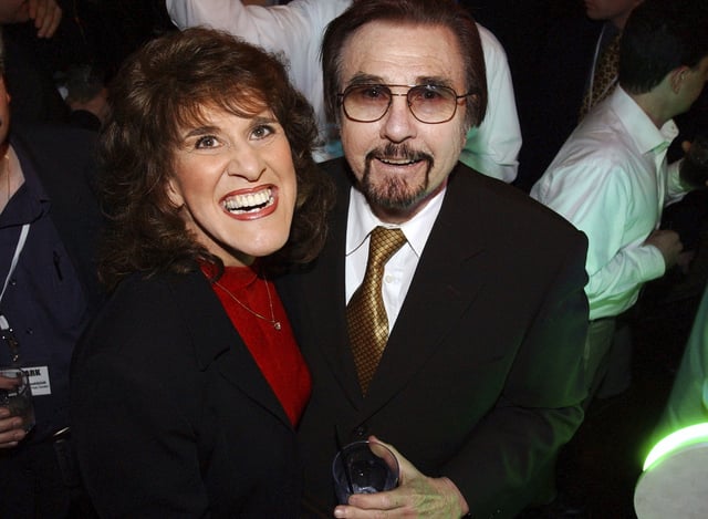 FILE - "Rowan & Martin's Laugh-In" co-stars Ruth Buzzi and Gary Owens share a laugh during NBC's 75th Anniversary Party, in Los Angeles, Jan. 9, 2002. (AP Photo/Rene Macura, File)