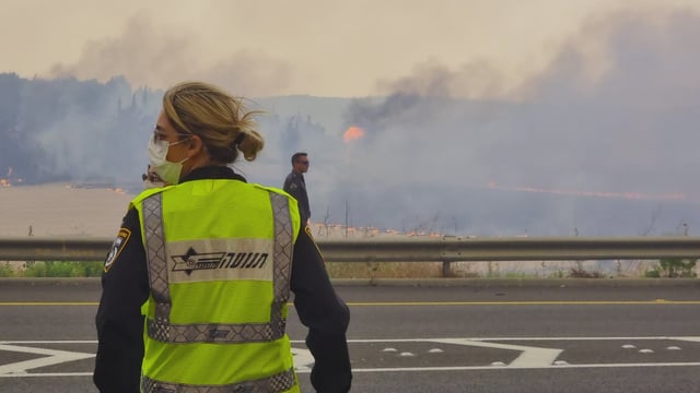 Israeli authorities regulating traffic amid wildfires on April 30, 2025