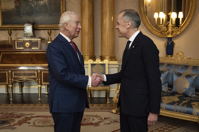 King Charles III, left, holds an audience with Canada's Prime Minister Mark Carney, right, at Buckingham Palace in London, England, Monday, March 17, 2025. 