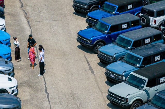 In an aerial view, Ford Broncos are seen for sale on a lot at a dealership on April 18, 2025 in Austin.