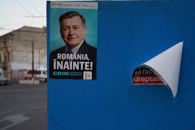 An electoral poster of Crin Antonescu is seen on a wall ahead of Romania’s presidential elections, in Bucharest, Romania, April 29, 2025. REUTERS/Andreea Campeanu/File Photo
