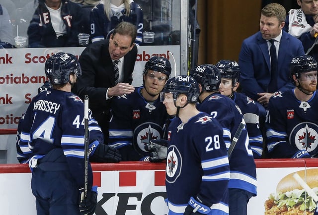 Winnipeg Jets head coach Scott Arniel talks to his team during first period NHL action against the St. Louis Blues in Winnipeg on Monday, April 7, 2025.