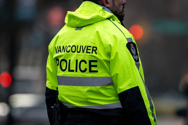 A Vancouver Police officer is pictured in Vancouver on Wednesday, Dec. 4, 2024. One of Canada's most wanted fugitives is back behind bars following a Vancouver Police Department investigation that lasted three years, spanned 14 countries and ended in the Middle East. THE CANADIAN PRESS/Ethan Cairns