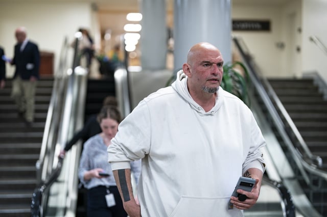 Sen. John Fetterman (D-PA) departs the US Capitol on March 25, 2025 in Washington, DC. Republicans are meeting as the Trump administration faces blowback after defense plans that were posted in a group chat including top cabinet officials on the Signal app were accidentally shared with Jeffrey Goldberg, the editor-in-chief of The Atlantic magazine.