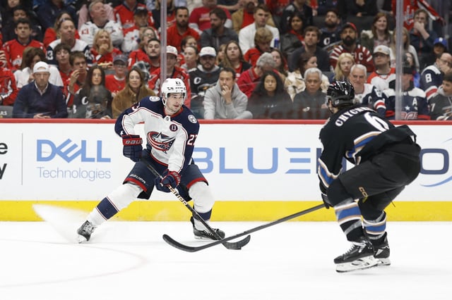 FILE PHOTO:Apr 13, 2025; Washington, District of Columbia, USA; Columbus Blue Jackets center Sean Monahan (23) skates with the puck as Washington Capitals defenseman Jakob Chychrun (6) defends in the second period at Capital One Arena. Mandatory Credit: Geoff Burke-Imagn Images/File Photo