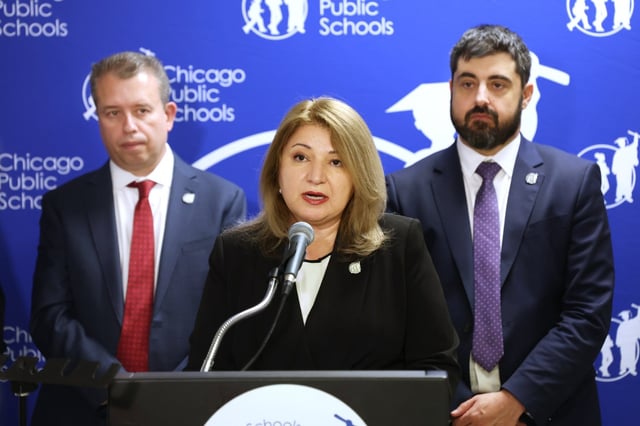 At Chicago Public Schools headquarters, CEO Pedro Martinez, left, and CPS Chief Talent Officer Ben Felton, right, listen as CPS Chief Education Officer Bogdana Chkoumbova discusses the details of a tentative contract agreement with the Chicago Teachers Union on April 1, 2025. (Terrence Antonio James/Chicago Tribune)