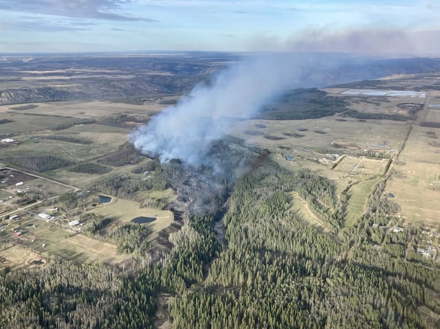 The Fish Creek Community Forest wildfire near Fort St. John, B.C., burns in this recent handout photo. The City of Fort St. John, B.C., says people evacuated due to a wildfire on the outskirts of the community are allowed to return home. An update posted to the city's Facebook page at 8:45 a.m. says the fire in the Fish Creek Community Forest was moving northeast, away from the city. THE CANADIAN PRESS/HO - BC Wildfire Service
