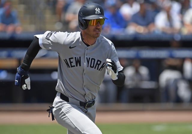 Cody Bellinger #35 of the New York Yankees runs out a ground ball in the first inning against the Tampa Bay Rays at George M. Steinbrenner Field on April 20, 2025 in Tampa, Florida.