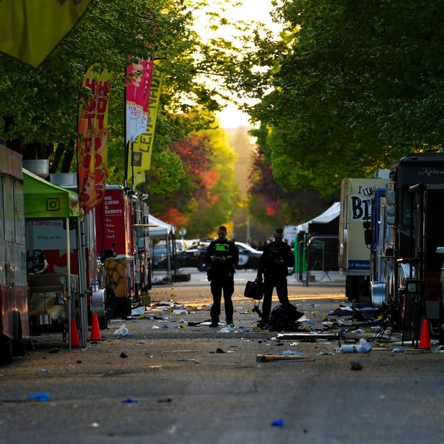 Members of the Vancouver Police forensics team examine the scene where a vehicle drove into a crowd at a Lapu Lapu Day street festival Saturday evening in Vancouver, Sunday, April 27, 2025. Shock and grief rippled through Canada's Filipino community on Sunday as members struggled to come to grips with an attack at a cultural street festival in Vancouver on Saturday that killed 11 people and injured dozens more. THE CANADIAN PRESS/Sean Kilpatrick