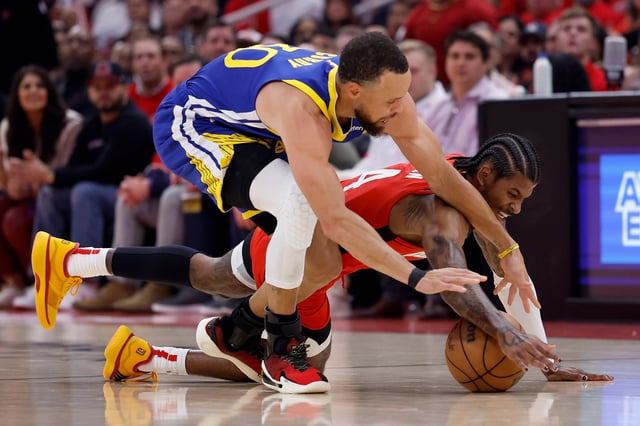 Jalen Green #4 of the Houston Rockets and Stephen Curry #30 of the Golden State Warriors battle for a loose ball in the first half in Game Two of the Western Conference First Round NBA Playoffs at Toyota Center on April 23, 2025 in Houston, Texas.