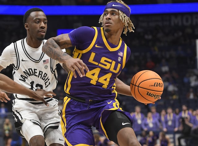 Mar 9, 2023; Nashville, TN, USA;  LSU Tigers guard Adam Miller (44) drives past Vanderbilt Commodores guard Trey Thomas (12) during the first half at Bridgestone Arena. Mandatory Credit: Steve Roberts-USA TODAY Sports/File Photo