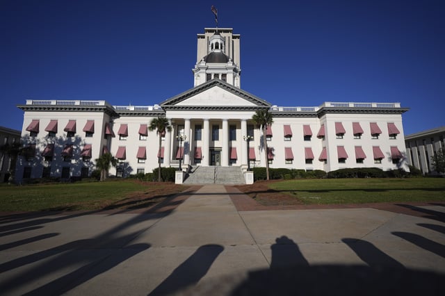 FILE - The Old Florida Capitol is seen with the tower of the current Florida Capitol rising behind, during a legislative session in Tallahassee, Fla., March 6, 2025. (AP Photo/Rebecca Blackwell, File)