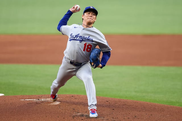 May 2, 2025; Atlanta, Georgia, USA; Los Angeles Dodgers starting pitcher Yoshinobu Yamamoto (18) throws against the Atlanta Braves in the first inning at Truist Park. Brett Davis-Imagn Images