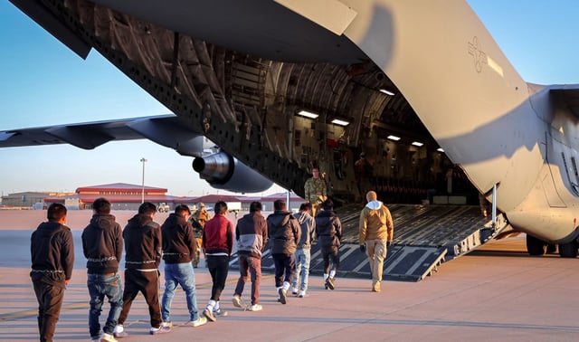 White House press secretary Karoline Leavitt posted a photo on X on January 24 showing migrants boarding a military plane for deportation. (X/@PressSec)