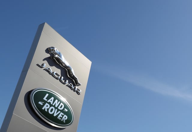 Logos of Jaguar and Land-Rover are seen outside a car dealer in Brussels, Belgium May 28, 2020. REUTERS/Yves Herman/File Photo