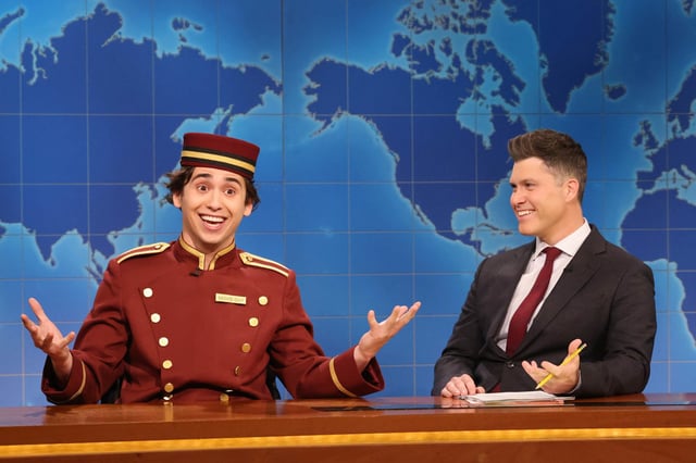(l-r) Marcello Hernández as The Movie Guy and anchor Colin Jost during Weekend Update on SNL, March 1, 2025