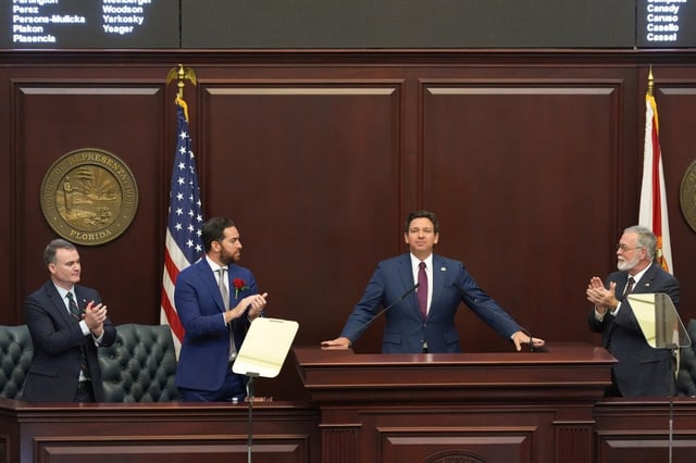 FILE – Florida Gov. Ron DeSantis, center right, is applauded by, from left, House Speaker pro tempore Rep. Wyman Duggan, House Speaker Rep. Daniel Perez, and Senate President Ben Albritton, as he gives his State of the State address to a joint session on the opening day of the 2025 legislative session, Tuesday, March 4, 2025, at the state capitol in Tallahassee, Fla. (AP Photo/Rebecca Blackwell, File)