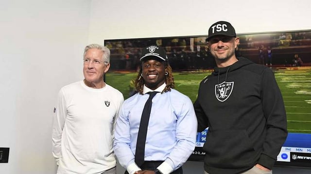 Apr 25, 2025; Henderson, NV, USA; (L-R) Las Vegas Raiders head coach Pete Carroll, Ashton Jeanty and general manager John Spytek pose after a news conference introducing Jeanty as the first round draft pick in the 2025 NFL Draft at Intermountain Health Performance Center. Mandatory Credit: Candice Ward-Imagn Images