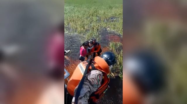 This still from video released by the Bolivian Defense Ministry shows five people being rescued after their plane crashed in an Amazonian jungle.