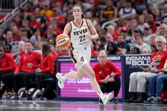 Caitlin Clark #22 of the Indiana Fever brings the ball up court during the first half of a game against the Washington Mystics at Gainbridge Fieldhouse on June 19, 2024 in Indianapolis, Indiana. NOTE TO USER: User expressly acknowledges and agrees that, by downloading and or using this photograph, User is consenting to the terms and conditions of the Getty Images License Agreement.