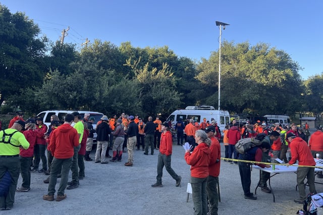 Specialized rescuers and volunteers search for a missing hiker at the Windy Hill Open Space Preserve in Portola Valley.