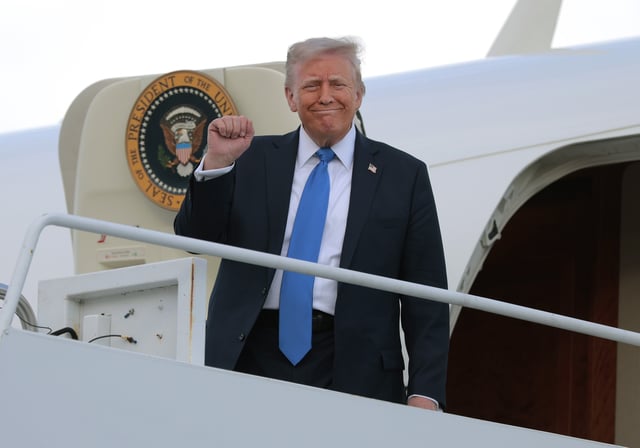 President Donald Trump disembarks from Air Force One at Tuscaloosa National Airport on May 1 in Alabama.