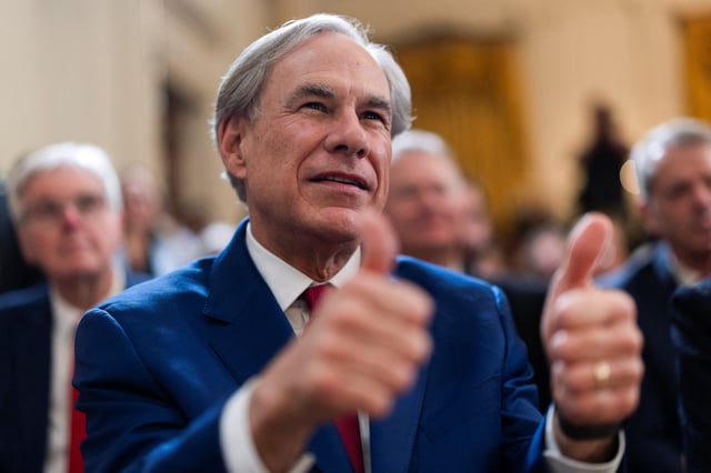 Texas Governor Greg Abbott gives the thumbs up during the signing event for an executive order to shut down the Department of Education by U.S. President Donald Trump, in the East Room at the White House in Washington, D.C., U.S., March 20, 2025. REUTERS/Carlos Barria