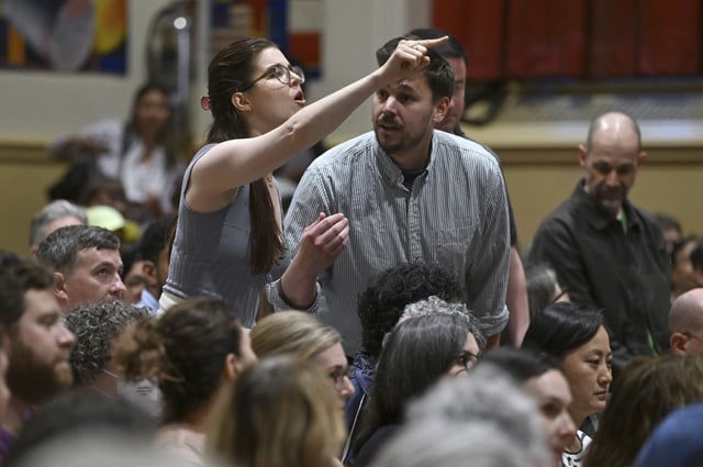 An attendee shouts at Rep. Alexandria Ocasio-Cortez (D-NY) during a town hall gathering about her stance on the Israel / Palestine conflict in the Jackson Heights neighborhood of the New York City borough of Queens, NY, May 2, 2025.