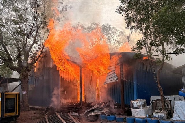 A fire burns following an aerial bombardment at a hospital runs by Médecins Sans Frontières in the northern town of Old Fangak in South Sudan.
