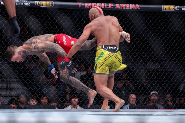 Deiveson Figueiredo of Brazil and Cody Garbrandt exchange strikes during their bantamweight fight at T-Mobile Arena on April 13, 2024 in Las Vegas, Nevada.