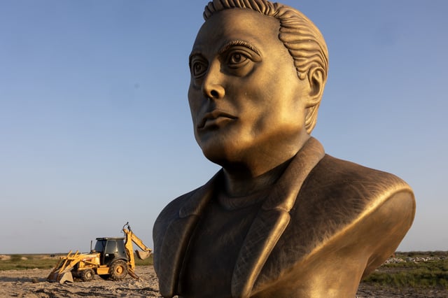 A statue of Elon Musk sits by the side of the road leading to his Space X facility, February 6, 2025 on the outskirts of Brownsville, Texas.