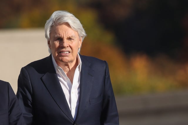 CENTRAL ISLIP, NEW YORK - OCTOBER 25: Former Abercrombie &amp; Fitch CEO Mike Jeffries leaves a Long Island court with members of his legal team after pleading not guilty to sex-trafficking charges allegedly involving young male models on October 25, 2024 in Central Islip, New York. Jeffries, who is 80, was released on a $10 million bond and answered to 16 counts against him.  (Photo by Spencer Platt/Getty Images)