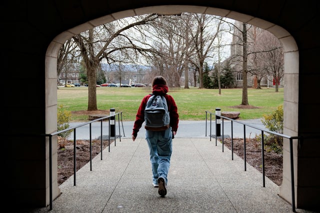 A person walks on campus at Muhlenberg College in Allentown, Penn., on March 26, 2025.