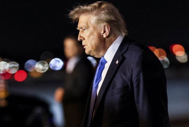 U.S. President Donald Trump walks after disembarking from Air Force One at Palm Beach International Airport, West Palm Beach, Florida, U.S. May 1, 2025. REUTERS/Leah Millis/File Photo