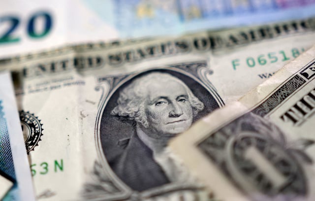 U.S. dollar banknotes are seen in this illustration taken May 4, 2025. REUTERS/Dado Ruvic/Illustration