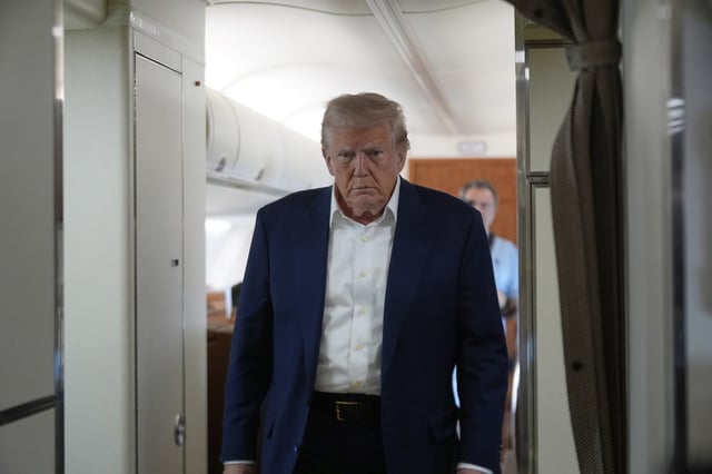 President Donald Trump walks to talk with reporters on Air Force One as he heads back to Washington, Sunday, May 4, 2025, from West Palm Beach, Fla. (AP Photo/Manuel Balce Ceneta)